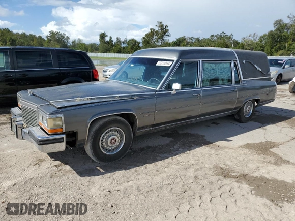 1988 Cadillac Brougham z VIN 1G6DW51Y2J9714052, wystawiony jako Copart lot #77274064 z przebiegiem 69 106 mil mil oraz Szkoda całkowita • Salvage title. Historia ofert i sprzedaży dostępna na DreamBid. Obrazek 1.