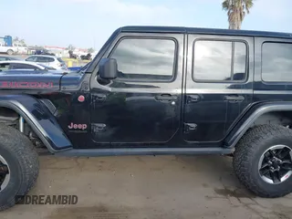 2020 Jeep Wrangler Unlimited Rubicon with VIN 1C4HJXFG1LW141335, listed as a IAAI auction lot 42724973 with 59,843 mi miles and . Bid and sale history available at DreamBid. Image 14.