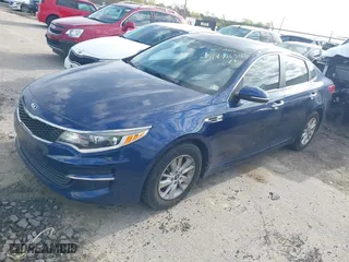 2016 Kia Optima LX with VIN 5XXGT4L3XGG081911, listed as a IAAI auction lot 41933634 with 100,942 mi miles. Bid and sale history available at carsss.com. Image 17.