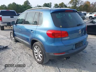 2017 Volkswagen Tiguan Wolfsburg Edition with VIN WVGRV7AX6HW504313, listed as a IAAI auction lot 40950812 with 149,884 mi miles and . Bid and sale history available at DreamBid. Image 3.