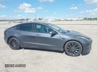 2022 Tesla Model 3 Performance with VIN 5YJ3E1EC9NF201184, listed as a IAAI auction lot 41534959 with 29,389 mi miles and . Bid and sale history available at DreamBid. Image 14.
