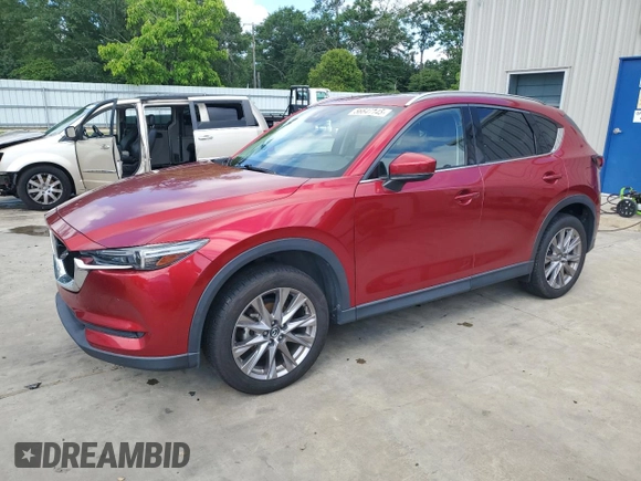 2019 Mazda CX-5 Grand Touring with VIN JM3KFADM2K1657915, listed as a Copart auction lot 56647145 with 85,095 mi miles and Salvage title. Bid and sale history available at DreamBid. Image 1.
