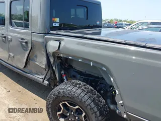 2021 Jeep Gladiator Rubicon with VIN 1C6JJTBG2ML515932, listed as a IAAI auction lot 42471704 with 57,775 mi miles and . Bid and sale history available at DreamBid. Image 6.
