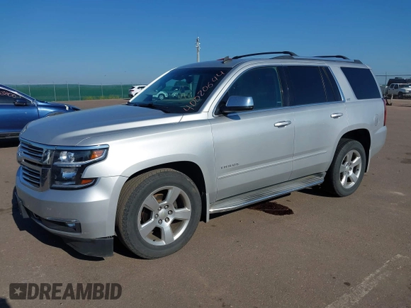 2015 Chevrolet Tahoe LTZ with VIN 1GNSKCKC5FR205739, listed as a IAAI auction lot 40020644 with 142,524 mi miles and . Bid and sale history available at DreamBid. Image 17.