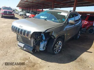 2021 Jeep Cherokee Altitude with VIN 1C4PJLLBXMD155096, listed as a IAAI auction lot 41746319 with 99,423 mi miles and . Bid and sale history available at DreamBid. Image 2.