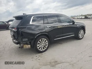 2021 Cadillac XT6 Premium Luxury z VIN 1GYKPCRS1MZ169952, wystawiony jako Copart lot #51908895 z przebiegiem 31 834 mil mil oraz Szkody całkowita. Historia ofert i sprzedaży dostępna na DreamBid. Obrazek 3.
