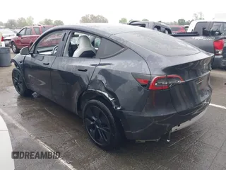 2025 Tesla Model Y Long Range with VIN 7SAYGDED8SA340082, listed as a IAAI auction lot 41915369 with 7,296 mi miles and . Bid and sale history available at carsss.com. Image 3.