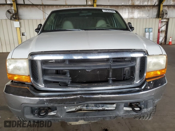 2000 Ford Super Duty F-250 XL with VIN 1FTNX21S9YED03242, listed as a Copart auction lot 74542704 with 218,739 mi miles and Salvage Title. Bid and sale history available at carsss.com. Image 5.