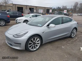 2018 Tesla Model 3 Long Range Battery with VIN 5YJ3E1EBXJF116906, listed as a IAAI auction lot 41913259 with 117,740 mi miles. Bid and sale history available at carsss.com. Image 2.