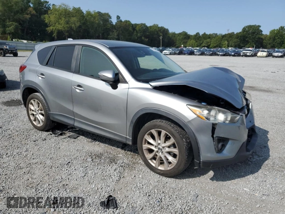 2015 Mazda CX-5 Grand Touring with VIN JM3KE4DY8F0540181, listed as a Copart auction lot 70624394 with 119,420 mi miles and Salvage Title. Bid and sale history available at carsss.com. Image 4.