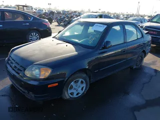 2005 Hyundai Accent GLS with VIN KMHCG45C75U632587, listed as a IAAI auction lot 40946829 with 114,666 mi miles. Bid and sale history available at carsss.com. Image 2.