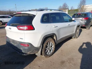 2016 Jeep Cherokee Latitude with VIN 1C4PJMCB1GW204412, listed as a IAAI auction lot 42031132 with 228,442 mi miles and . Bid and sale history available at carsss.com. Image 4.