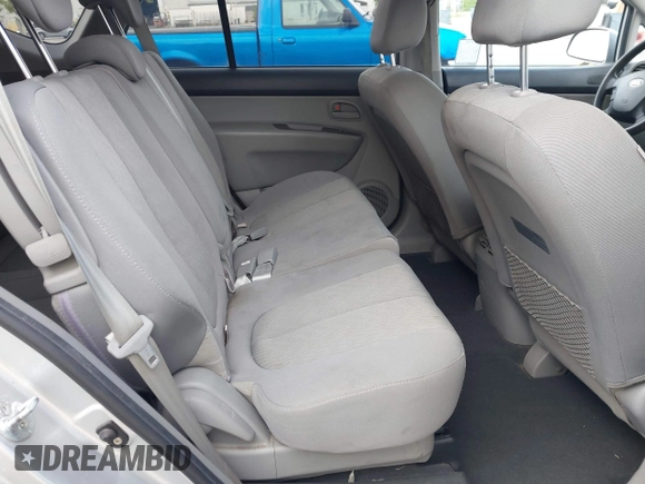 2009 Kia Rondo LX with VIN KNAFG528497222225, listed as a IAAI auction lot 42108192 with 113,040 mi miles. Bid and sale history available at carsss.com. Image 8.