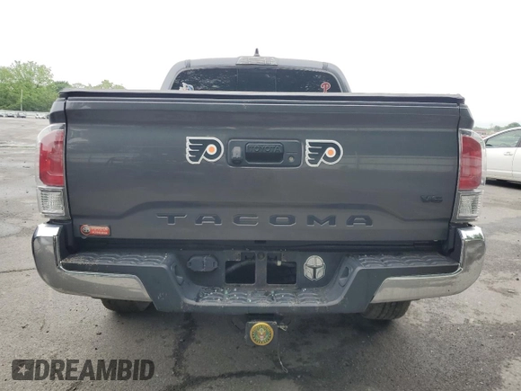 2021 Toyota Tacoma SR z VIN 3TYCZ5ANXMT050566, wystawiony jako Copart lot #57315615 z przebiegiem Nie podano mil oraz Szkoda całkowita • Salvage title. Historia ofert i sprzedaży dostępna na DreamBid. Obrazek 6.