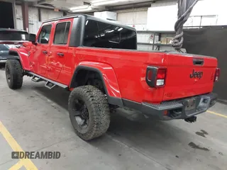 2022 Jeep Gladiator Altitude z VIN 1C6HJTAGXNL117353, wystawiony jako IAAI lot #42427921 z przebiegiem 28 801 mil mil oraz . Historia ofert i sprzedaży dostępna na DreamBid. Obrazek 3.