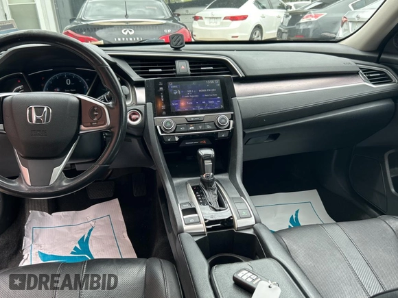 2017 Honda Civic EX-L с VIN 19XFC1F76HE013074, выставлен на аукционе Copart как лот 60144655 с пробегом 121 493 миль миль и Чистый • Clean title. История ставок и продаж доступна на DreamBid. Изображение 9.