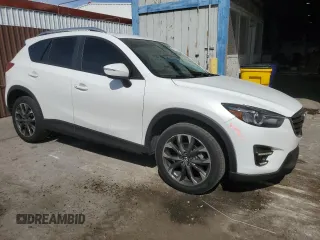 2016 Mazda CX-5 Grand Touring with VIN JM3KE4DY9G0662369, listed as a Copart auction lot 53169895 with 160,784 mi miles and Salvage Title. Bid and sale history available at carsss.com. Image 4.