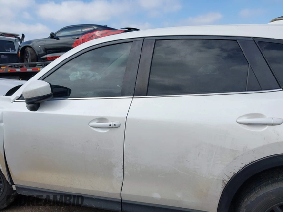 2020 Mazda CX-5 Touring with VIN JM3KFACM9L0771919, listed as a IAAI auction lot 41527773 with 93,417 mi miles and . Bid and sale history available at DreamBid. Image 15.