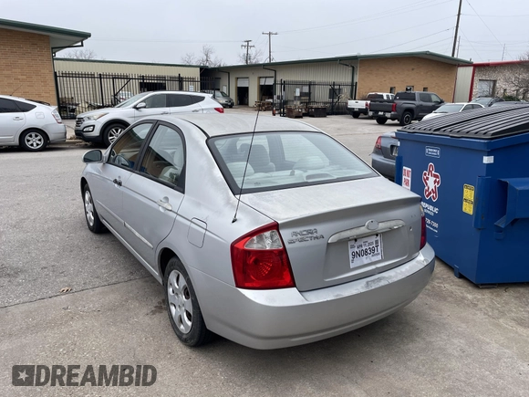 2004 Kia Spectra LX with VIN KNAFE121845043143, listed as a IAAI auction lot 41574523 with 211,758 mi miles. Bid and sale history available at carsss.com. Image 3.