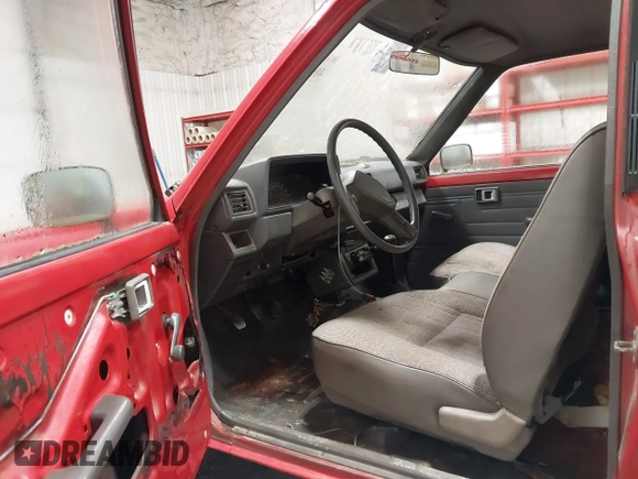 1987 Toyota Pickup with VIN JT4RN50R8H0221202, listed as a IAAI auction lot 40500429 with 304,229 mi miles and . Bid and sale history available at DreamBid. Image 8.