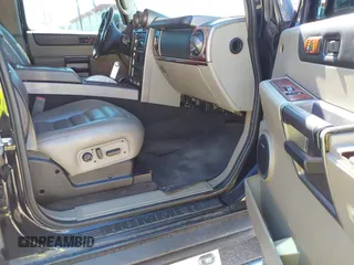 2004 Hummer H2 with VIN 5GRGN23U64H101592, listed as a IAAI auction lot 41379405 with 174,672 mi miles. Bid and sale history available at carsss.com. Image 5.