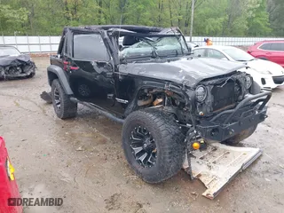 2015 Jeep Wrangler Unlimited Sport with VIN 1C4BJWDGXFL772352, listed as a IAAI auction lot 41973715 with 193,884 mi miles. Bid and sale history available at carsss.com. Image 1.