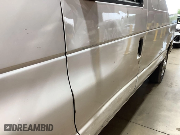 2013 Ford Econoline Cargo Commercial with VIN 1FTNE1EW9DDA61968, listed as a IAAI auction lot 42643038 with 121,719 mi miles and . Bid and sale history available at DreamBid. Image 31.