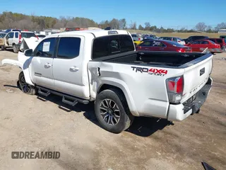 2022 Toyota Tacoma SR with VIN 3TMCZ5AN4NM470000, listed as a IAAI auction lot 41629818 with 78,138 mi miles and . Bid and sale history available at DreamBid. Image 3.
