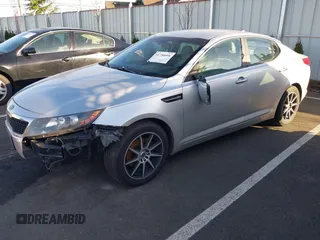 2012 Kia Optima LX with VIN KNAGM4A70C5282666, listed as a IAAI auction lot 41756098 with Not Provided miles and . Bid and sale history available at carsss.com. Image 2.