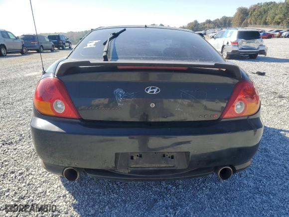 2003 Hyundai Tiburon GT with VIN KMHHN65F33U072954, listed as a Copart auction lot 77698094 with 235,445 mi miles and Salvage Title. Bid and sale history available at carsss.com. Image 6.