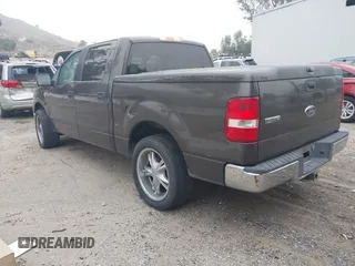 2005 Ford F-150 XLT with VIN 1FTRW12W15KE64553, listed as a IAAI auction lot 42009373 with 106,454 mi miles. Bid and sale history available at carsss.com. Image 3.