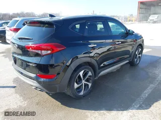 2017 Hyundai Tucson Value with VIN KM8J33A25HU586191, listed as a IAAI auction lot 41682127 with 58,877 mi miles. Bid and sale history available at carsss.com. Image 4.