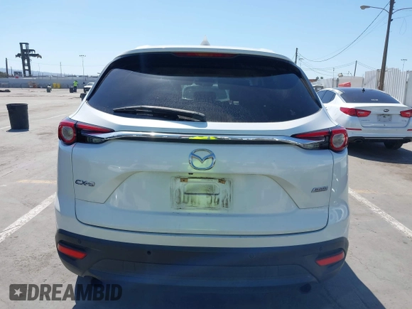 2019 Mazda CX-9 Touring with VIN JM3TCACY5K0306424, listed as a IAAI auction lot 42150466 with 95,166 mi miles and . Bid and sale history available at DreamBid. Image 16.
