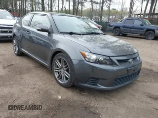 2012 Scion tC with VIN JTKJF5C7XC3031406, listed as a IAAI auction lot 41947478 with 150,762 mi miles. Bid and sale history available at carsss.com. Image 1.