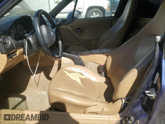 2002 Mazda MX-5 Miata Cloth z VIN JM1NB353220222868, wystawiony jako Copart lot #59944345 z przebiegiem 159 595 mil mil oraz Szkoda całkowita • Salvage title. Historia ofert i sprzedaży dostępna na DreamBid. Obrazek 7.