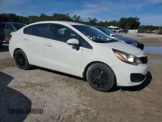 2015 Kia Rio LX with VIN KNADM4A38F6436457, listed as a Copart auction lot 68740994 with 87,474 mi miles and Salvage Title. Bid and sale history available at carsss.com. Image 4.