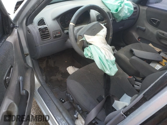 2002 Hyundai Accent GL with VIN KMHCG45C02U301443, listed as a Copart auction lot 80670164 with 124,163 mi miles and Salvage Title. Bid and sale history available at carsss.com. Image 8.