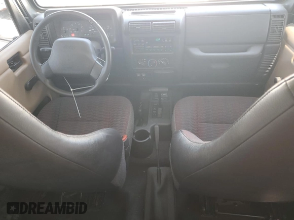 2000 Jeep Wrangler SE with VIN 1J4FA29P7YP737289, listed as a Copart auction lot 61869865 with 91,097 mi miles and Salvage title. Bid and sale history available at DreamBid. Image 8.