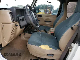 2000 Jeep Wrangler Sahara with VIN 1J4FA59SXYP760278, listed as a Copart auction lot 60402485 with 192,161 mi miles and Salvage title. Bid and sale history available at DreamBid. Image 7.