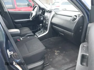 2010 Suzuki Grand Vitara Premium z VIN JS3TE0D27A4100764, wystawiony jako IAAI lot #41949104 z przebiegiem 144 684 mil mil oraz . Historia ofert i sprzedaży dostępna na DreamBid. Obrazek 5.