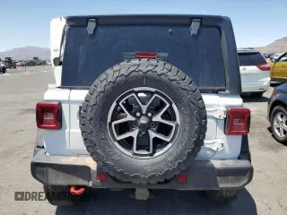2024 Jeep Wrangler Rubicon z VIN 1C4PJXFG1RW300794, wystawiony jako Copart lot #60173765 z przebiegiem 22 652 mil mil oraz Czysty tytuł • Clean title. Historia ofert i sprzedaży dostępna na DreamBid. Obrazek 6.