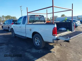 2000 Ford F-150 XL with VIN 1FTZX172XYNB36456, listed as a IAAI auction lot 41554603 with 239,766 mi miles. Bid and sale history available at carsss.com. Image 3.