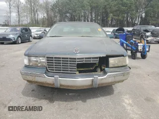 1996 Cadillac Fleetwood z VIN 1G6DW52P4TR704177, wystawiony jako Copart lot #49005355 z przebiegiem 145 635 mil mil oraz Czysty tytuł • Clean title. Historia ofert i sprzedaży dostępna na DreamBid. Obrazek 5.