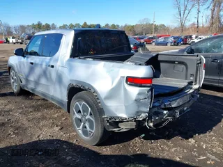 2022 Rivian R1T Adventure Package with VIN 7FCTGAAA1NN012328, listed as a IAAI auction lot 41307929 with 13,588 mi miles. Bid and sale history available at carsss.com. Image 3.