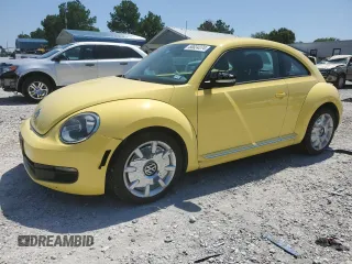 2012 Volkswagen Beetle 2.5L w/Sound/Nav PZEV with VIN 3VWJP7AT2CM603497, listed as a Copart auction lot 68034374 with 139,425 mi miles and Salvage Title. Bid and sale history available at DreamBid. Image 1.