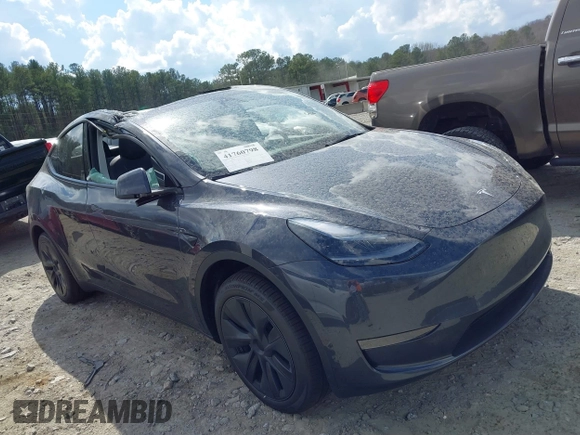 2025 Tesla Model Y Long Range with VIN 7SAYGDED3SA352138, listed as a IAAI auction lot 41760798 with 1,209 mi miles and . Bid and sale history available at DreamBid. Image 12.