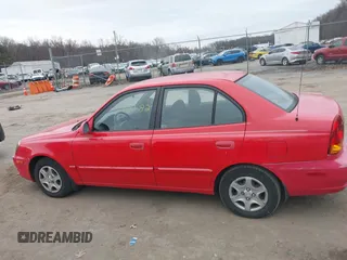2005 Hyundai Accent GLS with VIN KMHCG45CX5U614083, listed as a IAAI auction lot 41006582 with 72,516 mi miles. Bid and sale history available at carsss.com. Image 14.