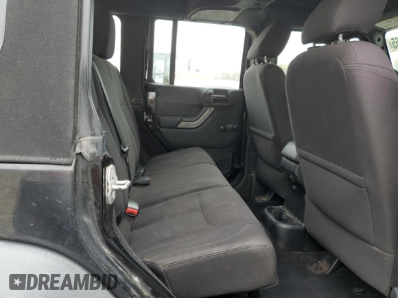 2015 Jeep Wrangler Unlimited Willys Wheeler with VIN 1C4BJWDG3FL601197, listed as a Copart auction lot 53832465 with 216,141 mi miles and Salvage Title. Bid and sale history available at DreamBid. Image 11.