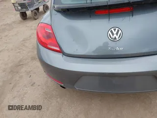 2012 Volkswagen Beetle with VIN 3VWV67AT0CM663718, listed as a IAAI auction lot 41860510 with 99,932 mi miles and . Bid and sale history available at DreamBid. Image 6.