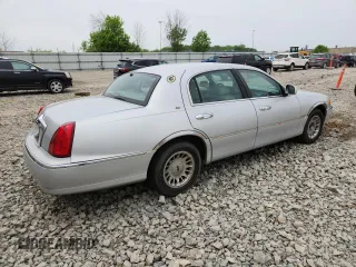 1998 Lincoln Town Car Cartier z VIN 1LNFM83W6WY649580, wystawiony jako Copart lot #59198865 z przebiegiem 253 735 mil mil oraz Czysty tytuł • Clean title. Historia ofert i sprzedaży dostępna na DreamBid. Obrazek 3.